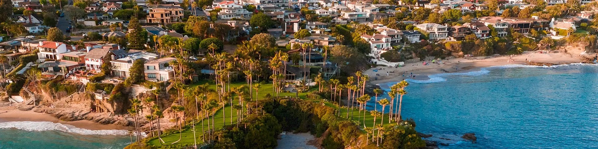 Image of a coastline with beaches and houses.